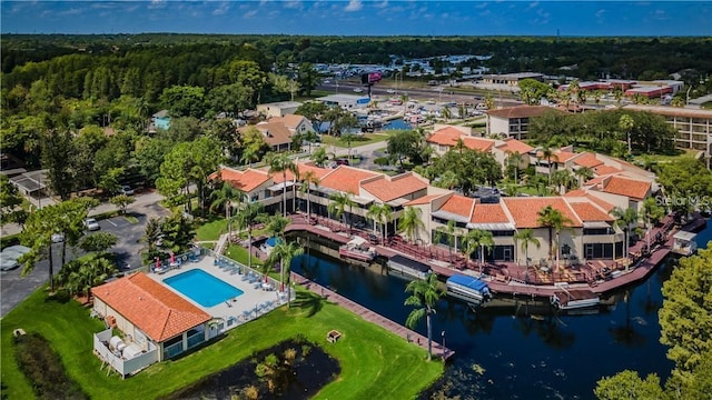 birds eye view of property with a water view