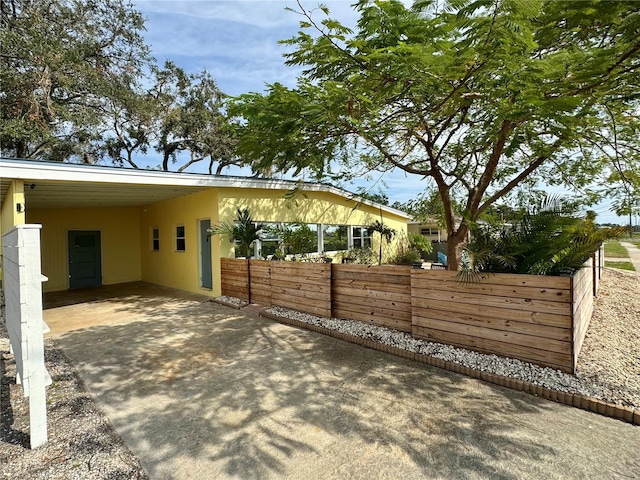 view of patio / terrace featuring a carport