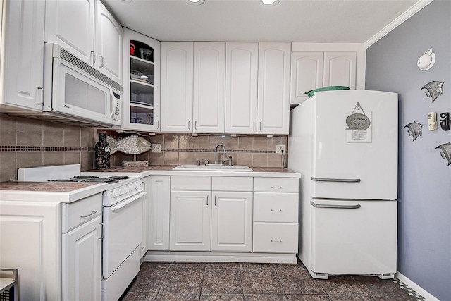 kitchen with decorative backsplash, white cabinetry, ornamental molding, sink, and white appliances