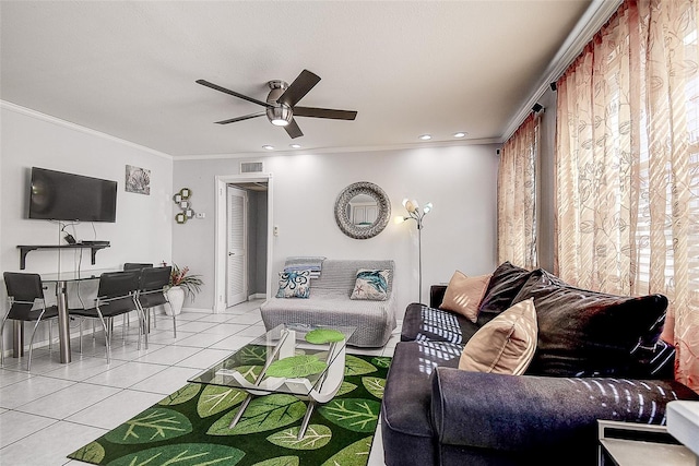 tiled living room featuring a wealth of natural light, crown molding, and ceiling fan