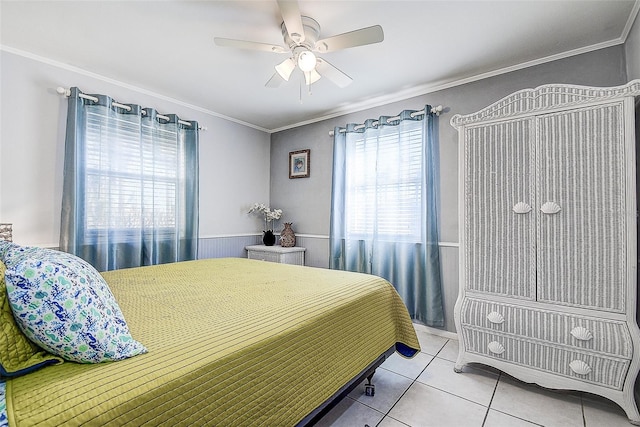 tiled bedroom featuring ceiling fan and crown molding