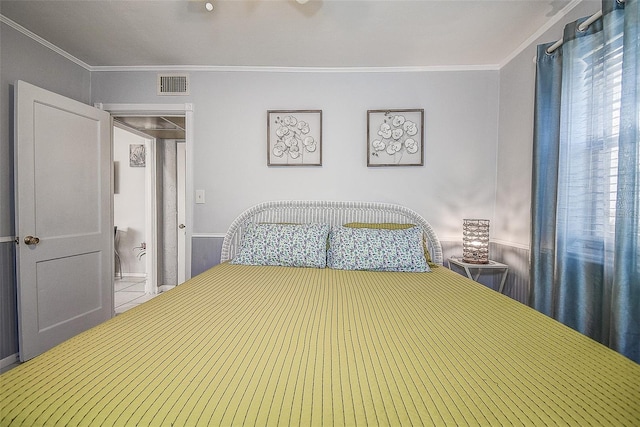 bedroom with crown molding