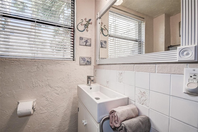 bathroom featuring vanity and a textured ceiling