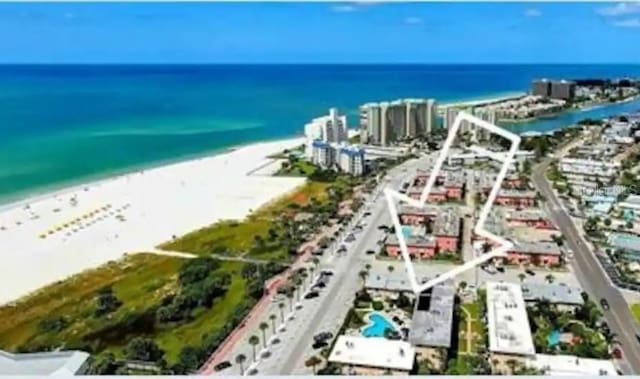 bird's eye view with a water view and a view of the beach