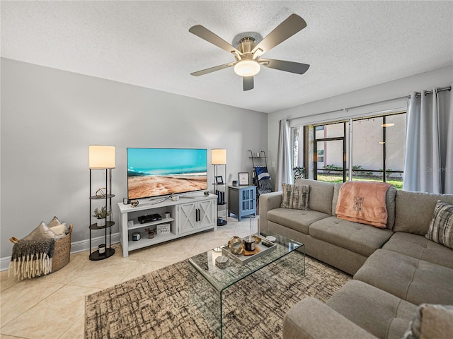 tiled living room with a textured ceiling and ceiling fan