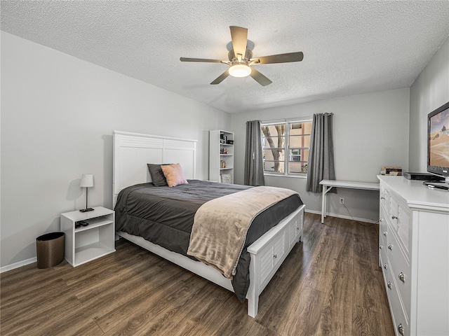 bedroom featuring a textured ceiling, dark hardwood / wood-style flooring, and ceiling fan