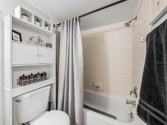 bathroom with a textured ceiling, shower / bath combo with shower curtain, and toilet