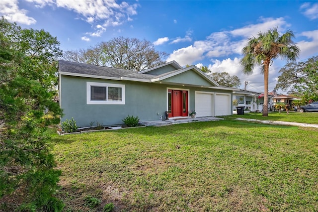 ranch-style house with a front yard and a garage