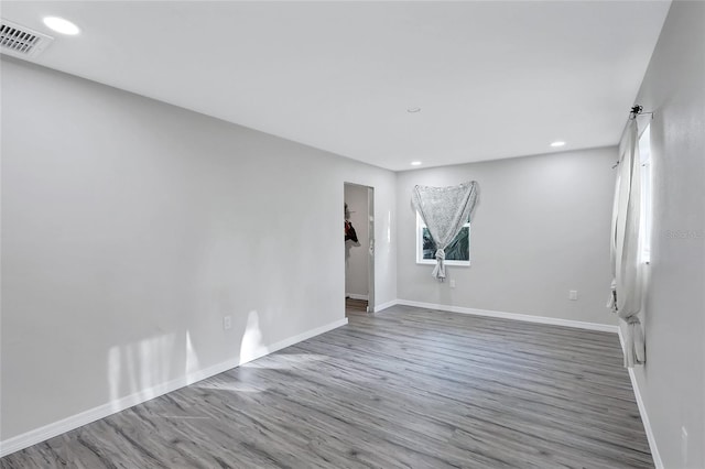 empty room featuring hardwood / wood-style floors and a healthy amount of sunlight