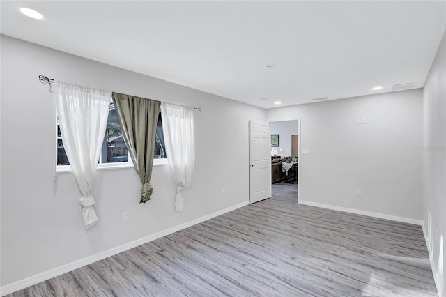 spare room featuring light hardwood / wood-style flooring