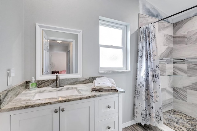 bathroom with vanity, a shower with curtain, and wood-type flooring