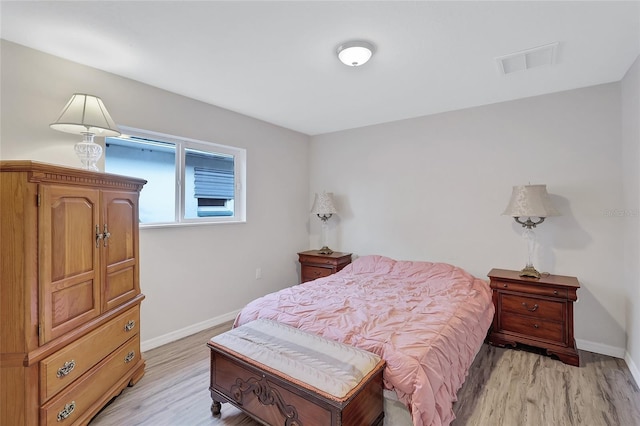 bedroom with light hardwood / wood-style floors