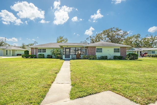 ranch-style home with a front yard