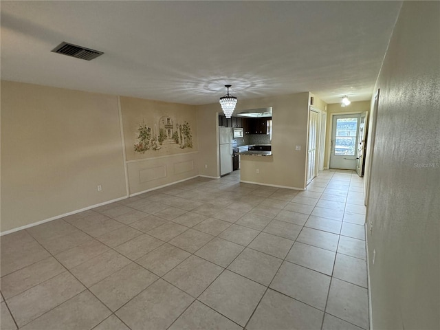 unfurnished living room featuring light tile patterned flooring