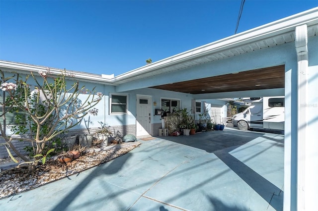 view of patio / terrace featuring a carport