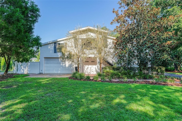 view of front facade featuring a front yard and a garage