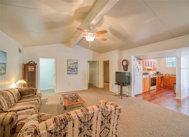 carpeted living room featuring ceiling fan, lofted ceiling with beams, and sink