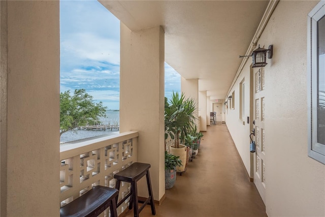 balcony featuring a water view