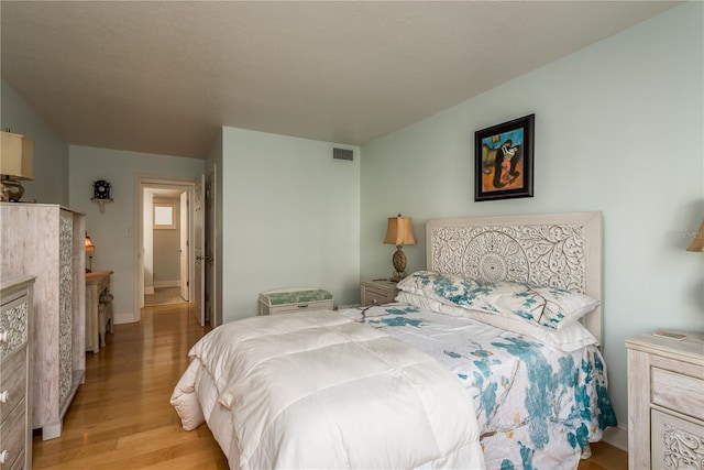 bedroom featuring light hardwood / wood-style floors