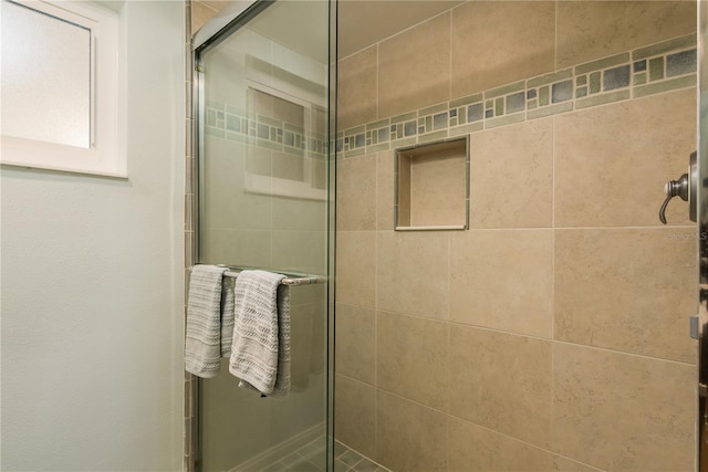 bathroom with an enclosed shower