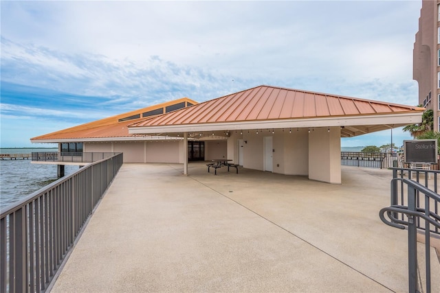 view of patio featuring a water view