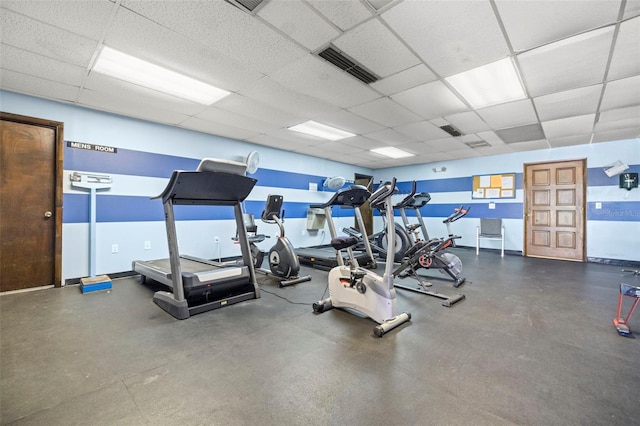 gym featuring a paneled ceiling