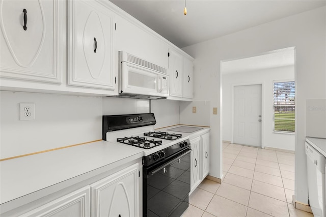 kitchen with white cabinetry, white appliances, and light tile patterned floors