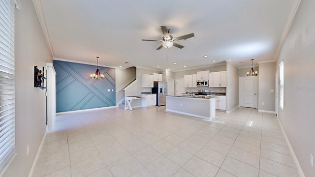 interior space with ornamental molding, light tile patterned floors, and ceiling fan with notable chandelier