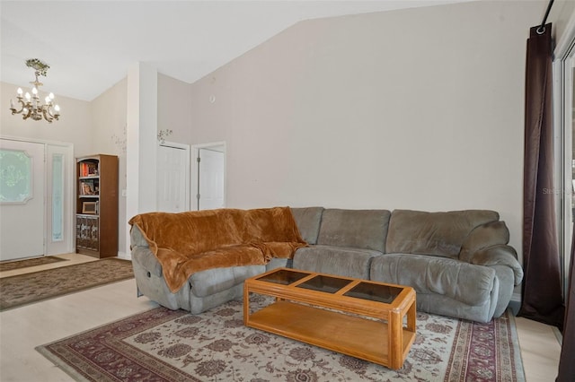 living room with high vaulted ceiling, light carpet, and a notable chandelier