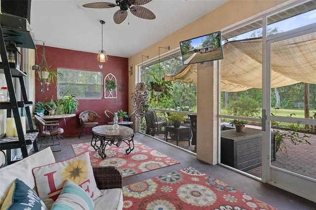 sunroom featuring ceiling fan