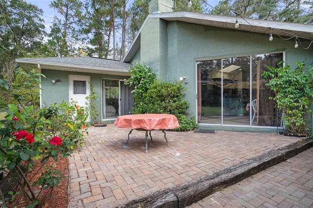 rear view of property featuring a patio area