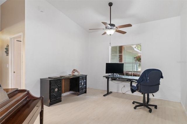 home office with wood finished floors and a ceiling fan