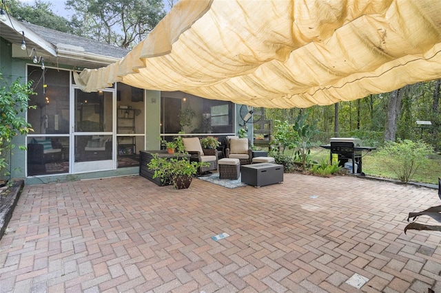 view of patio featuring a sunroom
