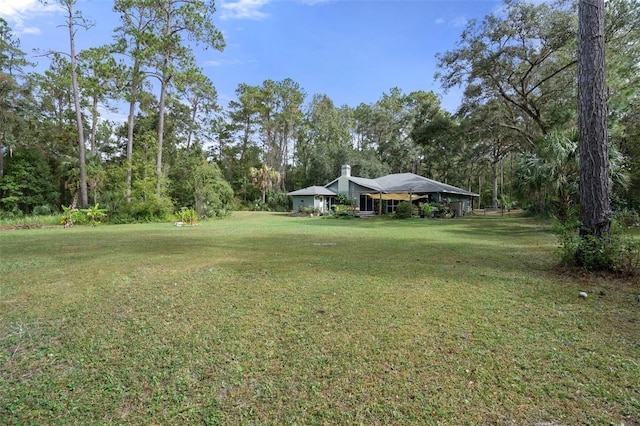 view of yard with a detached carport