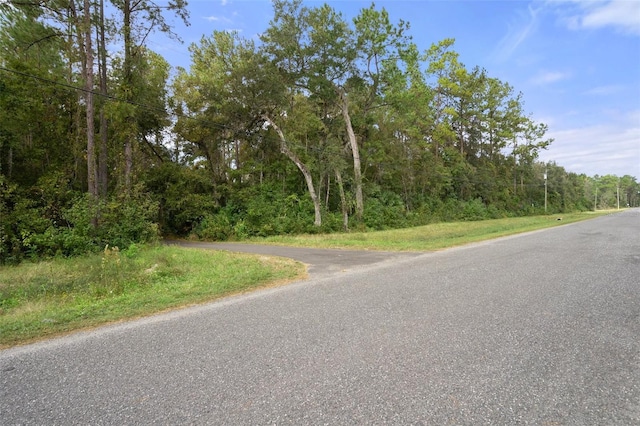 view of street featuring a view of trees