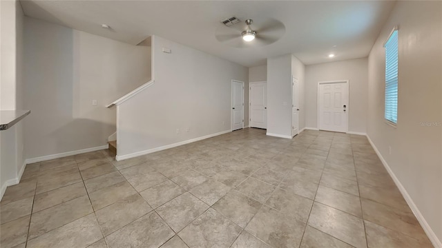 foyer entrance featuring ceiling fan