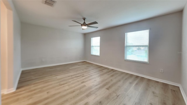 unfurnished room with light hardwood / wood-style flooring and ceiling fan