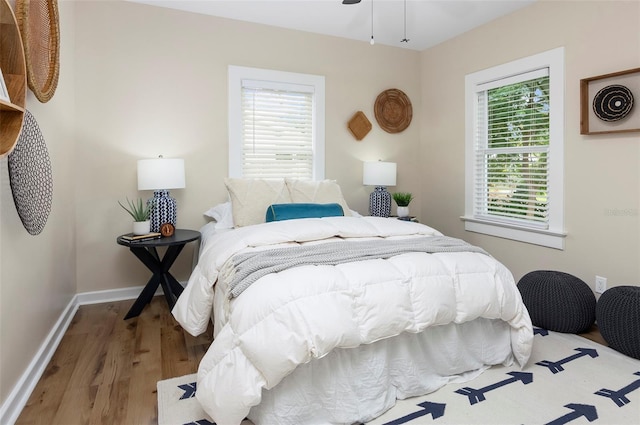 bedroom with hardwood / wood-style flooring