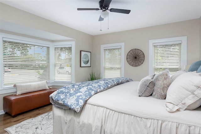 bedroom featuring ceiling fan and light hardwood / wood-style flooring