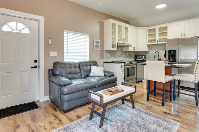 living room with light hardwood / wood-style flooring