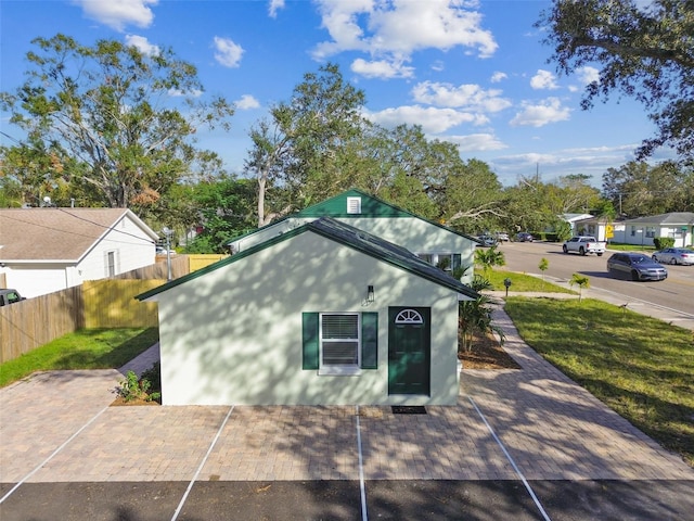 view of side of property featuring a yard