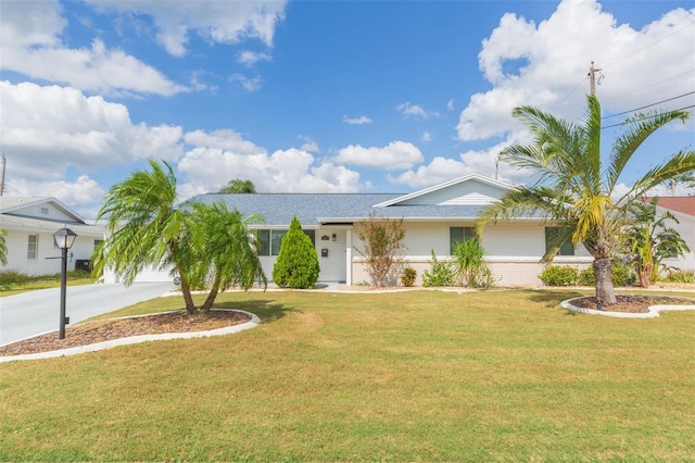 ranch-style home with a front yard