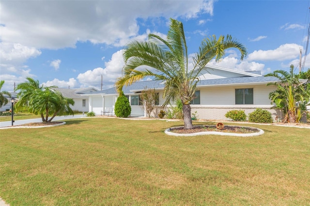 ranch-style home featuring a front yard