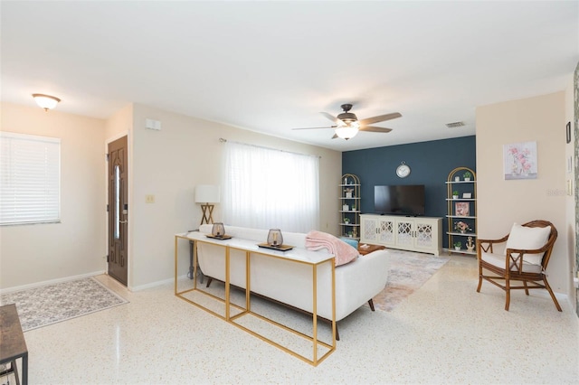 living room with ceiling fan