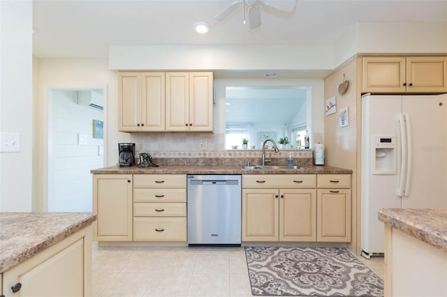 kitchen featuring ceiling fan, stainless steel dishwasher, light tile patterned flooring, sink, and white refrigerator with ice dispenser