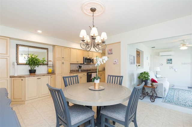 tiled dining space with an AC wall unit and ceiling fan with notable chandelier