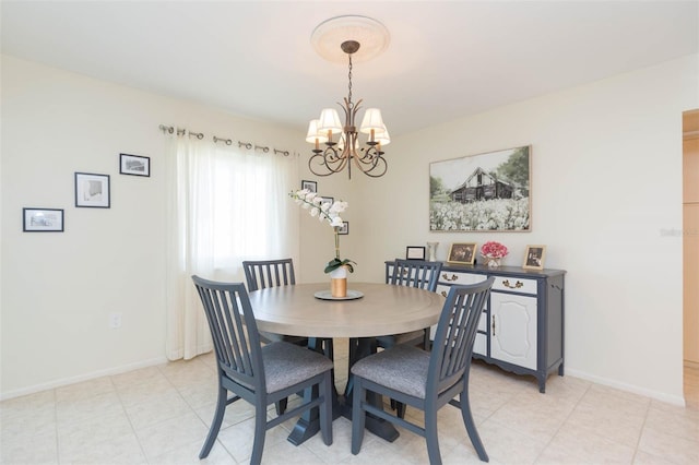 dining area with an inviting chandelier