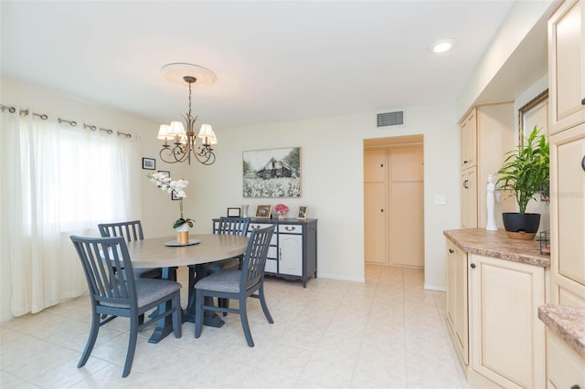 dining area with a notable chandelier