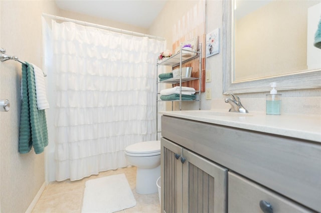 bathroom featuring vanity, toilet, tile patterned floors, and curtained shower