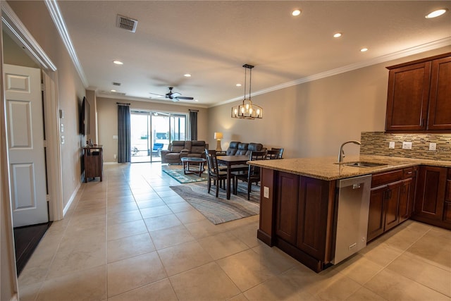 kitchen with decorative backsplash, kitchen peninsula, ornamental molding, sink, and stainless steel dishwasher